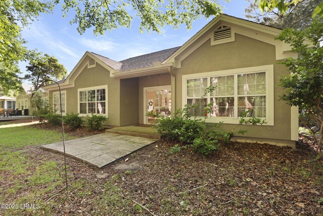 5 Canebrake Ln, Bluffton, SC 29910 - rear view of property with stucco siding, a patio area, and a shingled roof