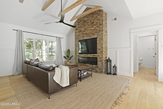 5 Canebrake Ln, Bluffton, SC 29910 - living area featuring a decorative wall, wood finished floors, beam ceiling, ceiling fan, and a wainscoted wall