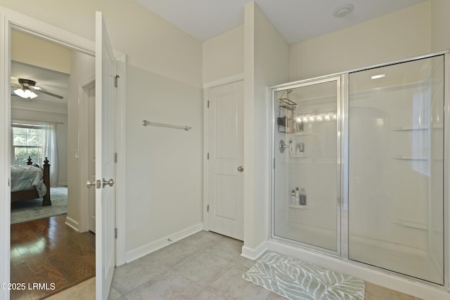 5 Junction Way, Bluffton, SC 29910 - ensuite bathroom featuring a stall shower, ceiling fan, baseboards, and tile patterned floors