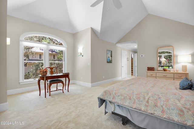 bedroom with ceiling fan, high vaulted ceiling, light colored carpet, and multiple windows