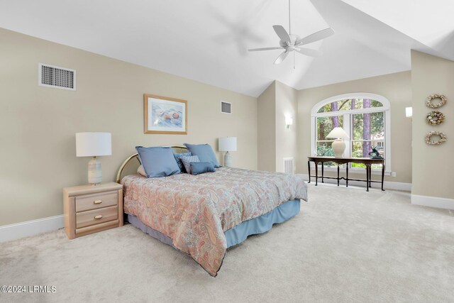 bedroom with lofted ceiling, light carpet, and ceiling fan