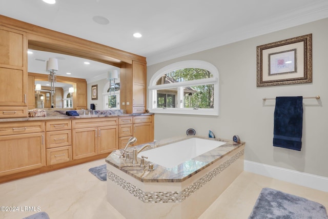 bathroom with crown molding, vanity, and a relaxing tiled tub