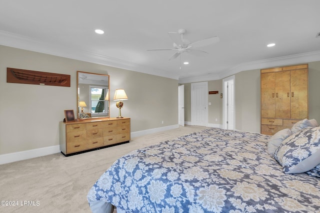 carpeted bedroom with crown molding and ceiling fan