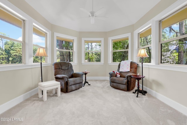 sunroom featuring ceiling fan