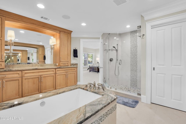 bathroom featuring ornamental molding, separate shower and tub, and vanity