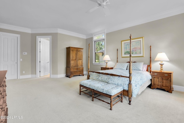 carpeted bedroom with ornamental molding and ceiling fan