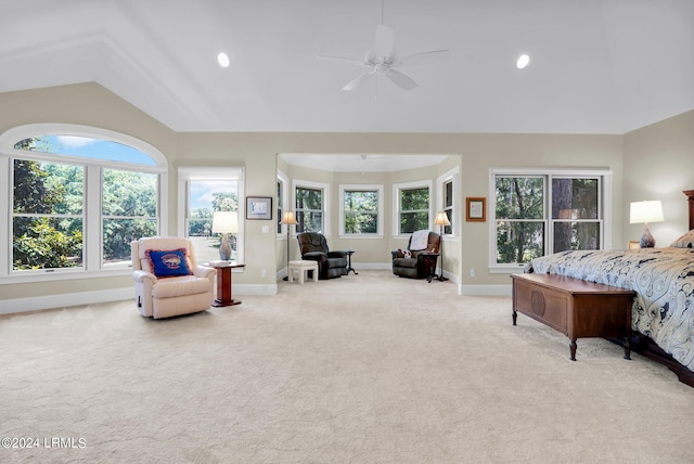 bedroom featuring lofted ceiling, light colored carpet, and ceiling fan