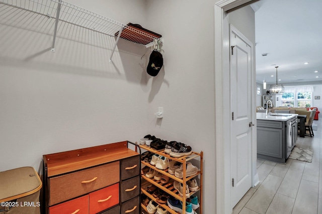 spacious closet featuring sink