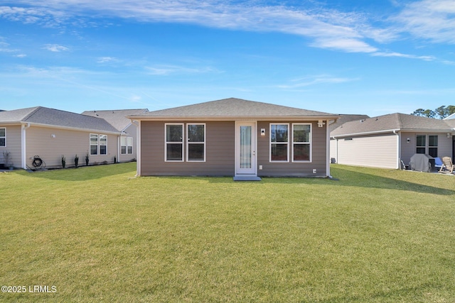 single story home featuring a front yard