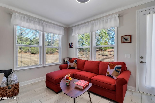 living room with plenty of natural light and ornamental molding