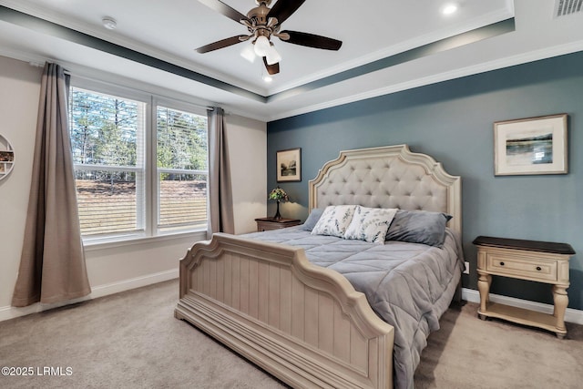 carpeted bedroom with crown molding, a raised ceiling, and ceiling fan