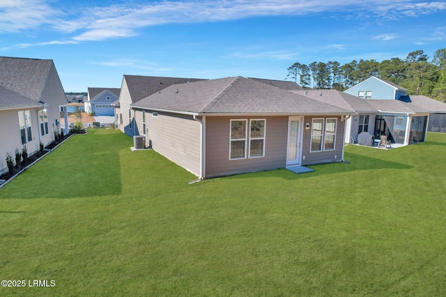 back of house featuring a yard