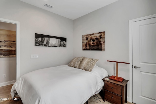 bedroom featuring hardwood / wood-style floors