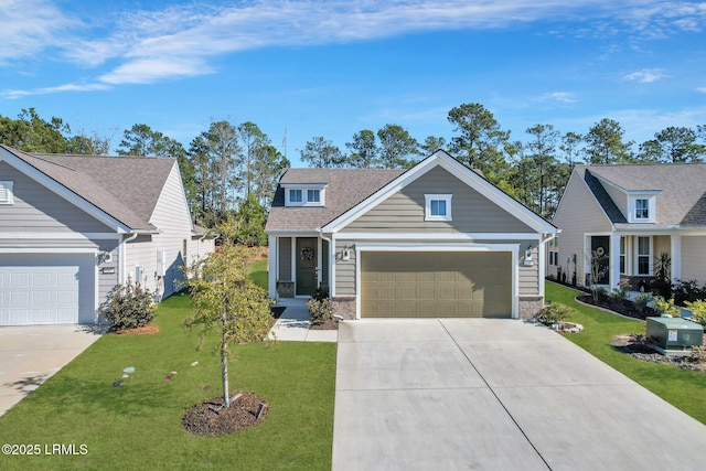 view of front of home with a garage and a front yard