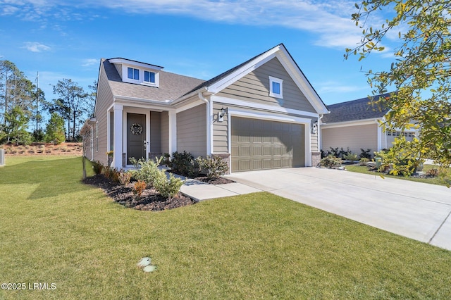 view of front of home featuring a garage and a front lawn