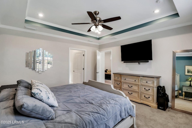 bedroom with crown molding, ceiling fan, a raised ceiling, and light carpet