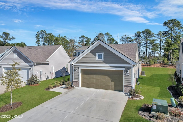 view of front of property with a garage and a front lawn