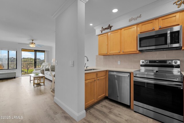 663 William Hilton Pkwy # 2309, Hilton Head Island, SC 29928 - kitchen featuring decorative backsplash, a sink, light wood-style floors, stainless steel appliances, and a ceiling fan