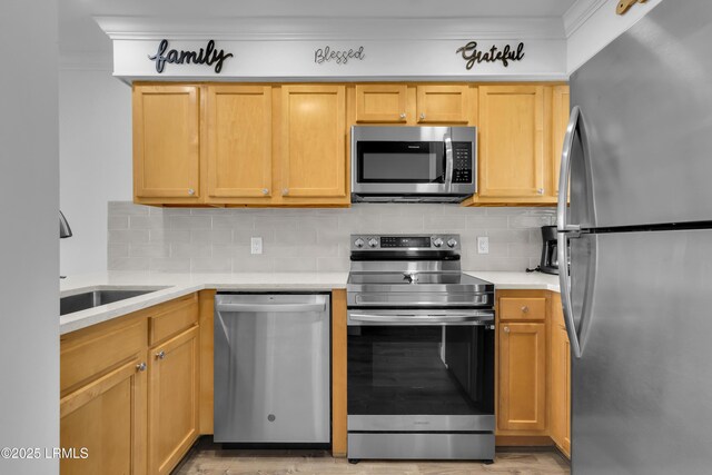 663 William Hilton Pkwy # 2309, Hilton Head Island, SC 29928 - kitchen with crown molding, a sink, stainless steel appliances, light countertops, and backsplash