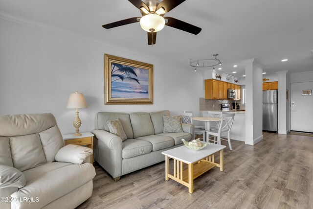 663 William Hilton Pkwy # 2309, Hilton Head Island, SC 29928 - living area with ornamental molding, recessed lighting, a ceiling fan, and light wood-style flooring