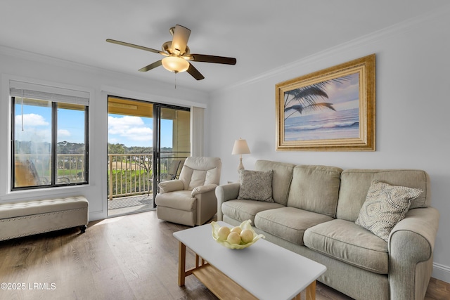 663 William Hilton Pkwy # 2309, Hilton Head Island, SC 29928 - living room featuring wood finished floors, a ceiling fan, crown molding, and plenty of natural light