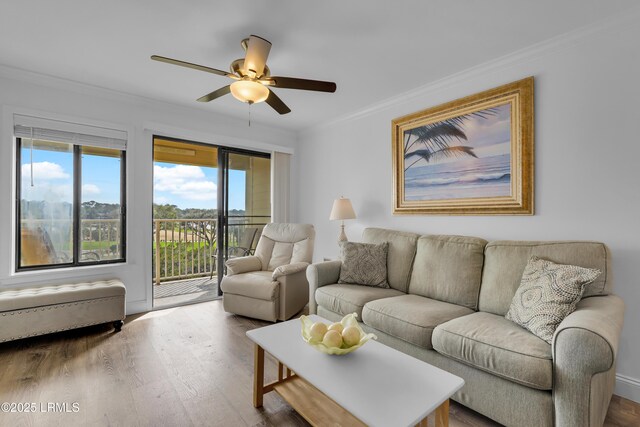 663 William Hilton Pkwy # 2309, Hilton Head Island, SC 29928 - living room with wood finished floors, ceiling fan, crown molding, and plenty of natural light
