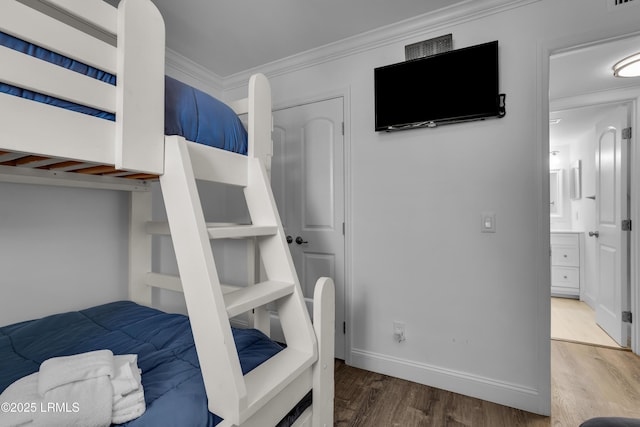 663 William Hilton Pkwy # 2309, Hilton Head Island, SC 29928 - bedroom with wood finished floors, ornamental molding, and baseboards