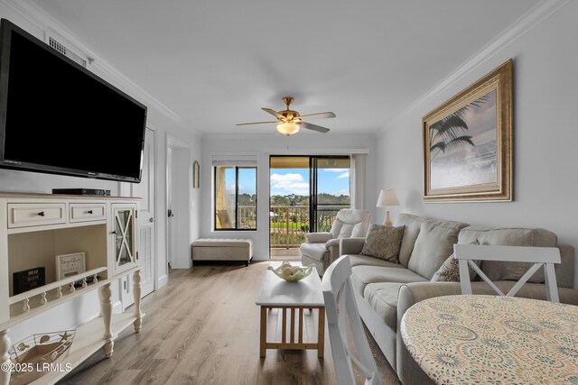 663 William Hilton Pkwy # 2309, Hilton Head Island, SC 29928 - living area with ornamental molding, a ceiling fan, and wood finished floors