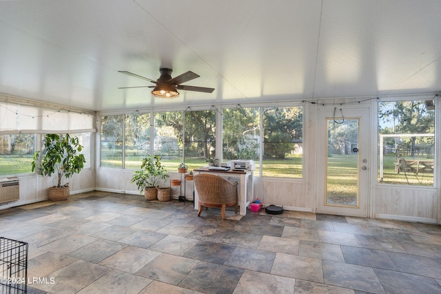 unfurnished sunroom with plenty of natural light and ceiling fan