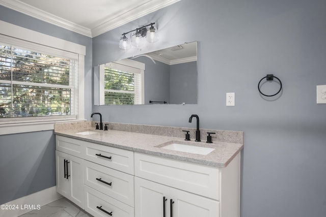 full bath with marble finish floor, ornamental molding, and a sink