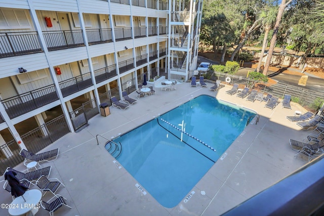 view of swimming pool with a patio area