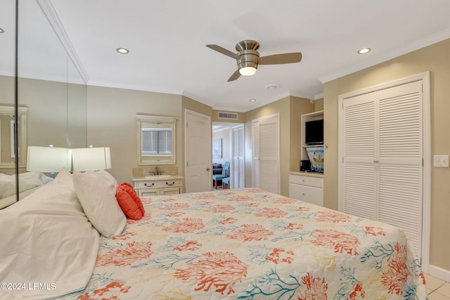 bedroom featuring multiple closets, ornamental molding, and ceiling fan