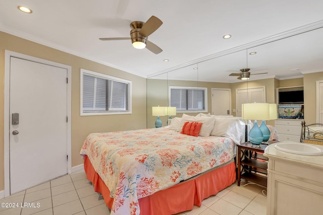 tiled bedroom with crown molding, sink, and ceiling fan