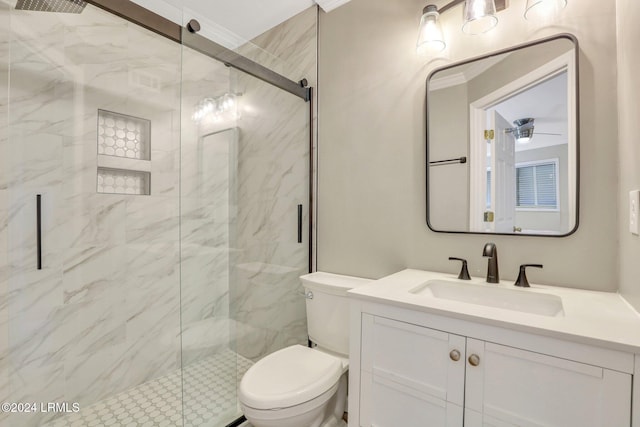 bathroom featuring ornamental molding, vanity, toilet, and a shower with shower door