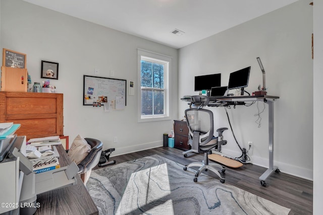 office with dark hardwood / wood-style flooring