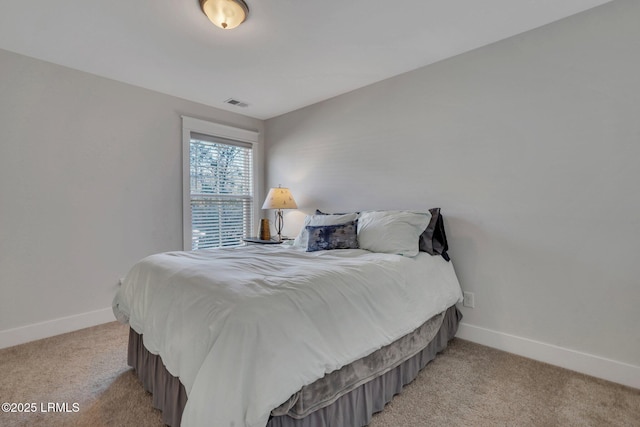 bedroom featuring light carpet