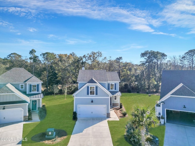 view of front of property featuring a garage and a front lawn