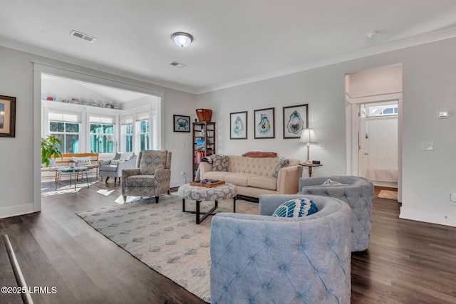 living room with dark wood-type flooring and ornamental molding