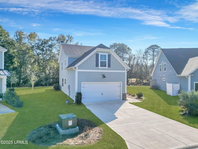 view of front of home with a garage and a front lawn