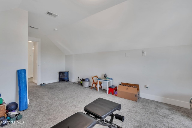 exercise room with lofted ceiling and carpet floors