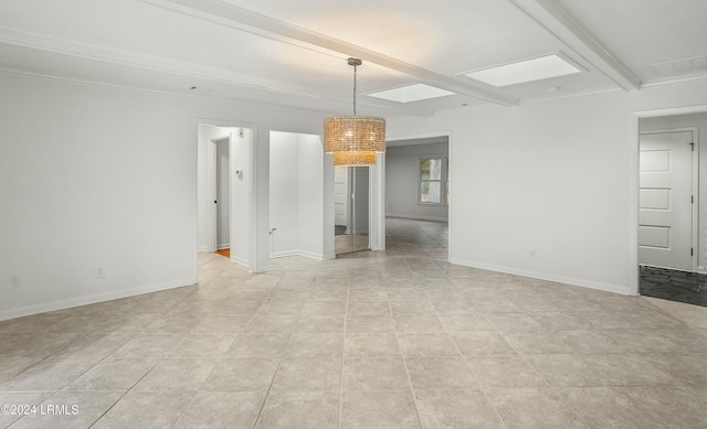 unfurnished room featuring crown molding and beam ceiling