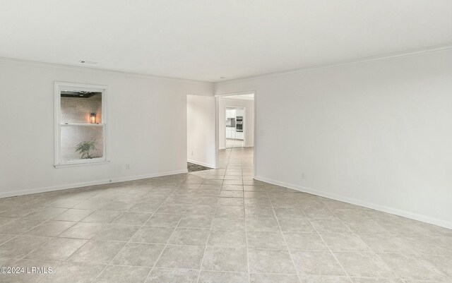 empty room featuring ornamental molding