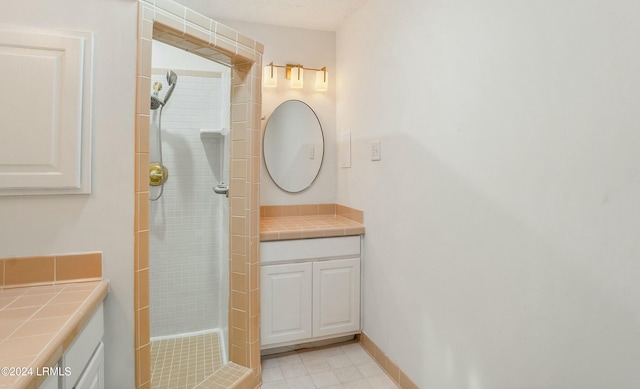 bathroom featuring vanity and tiled shower