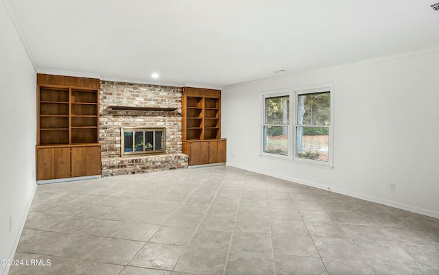 unfurnished living room with crown molding, a fireplace, and built in features