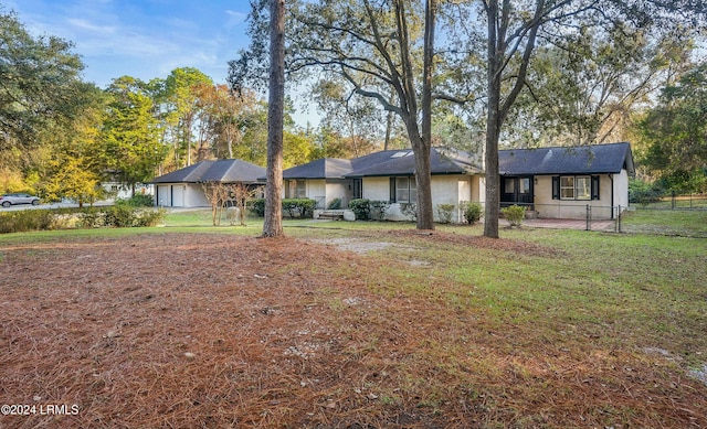 ranch-style house with a front lawn