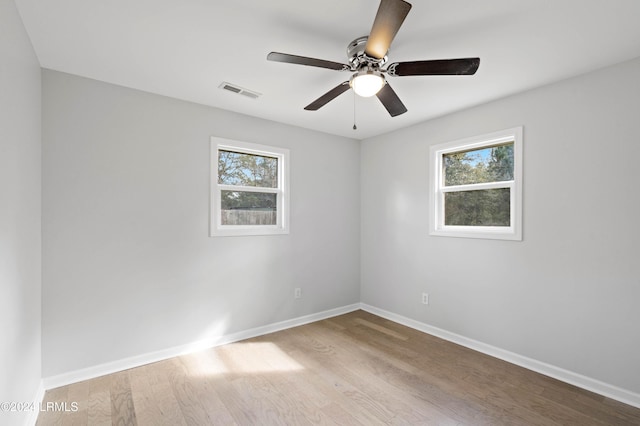 spare room with ceiling fan and light hardwood / wood-style floors