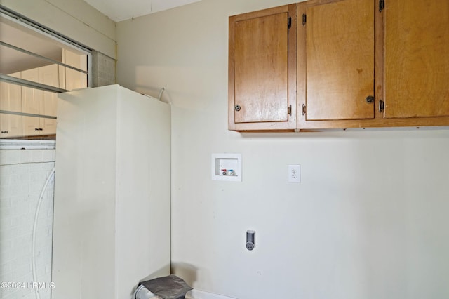 laundry room featuring cabinets, washer hookup, and hookup for an electric dryer