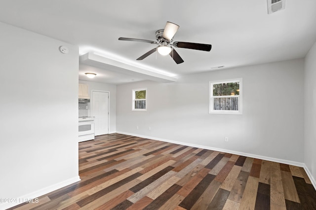 unfurnished room featuring ceiling fan and dark hardwood / wood-style flooring