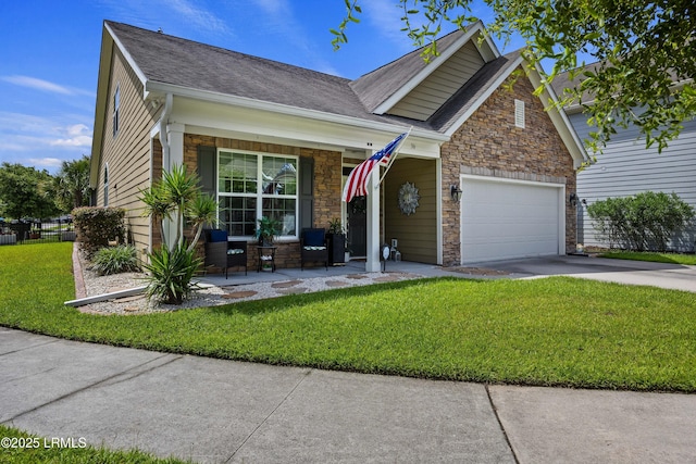 36 Independence Pl, Bluffton, SC 29910 - view of front facade with stone siding, covered porch, a front yard, and an attached garage