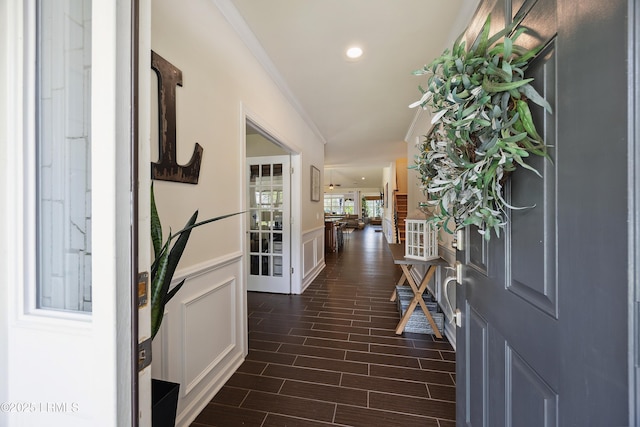 36 Independence Pl, Bluffton, SC 29910 - foyer entrance with wainscoting, dark wood-type flooring, recessed lighting, ornamental molding, and a decorative wall